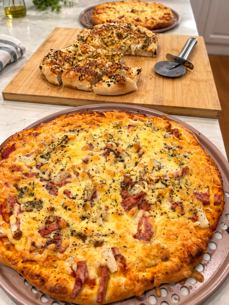 Homemade pizza and pizza bianca made with Thermomix® dough and sauce.
